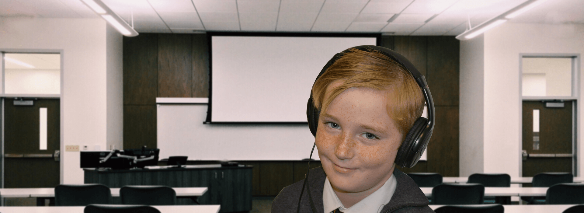 boy wearing headphones in classroom 