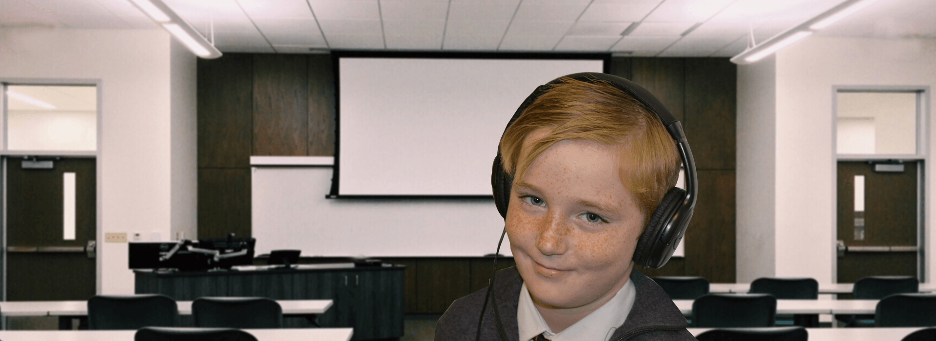 boy wearing headphones in classroom